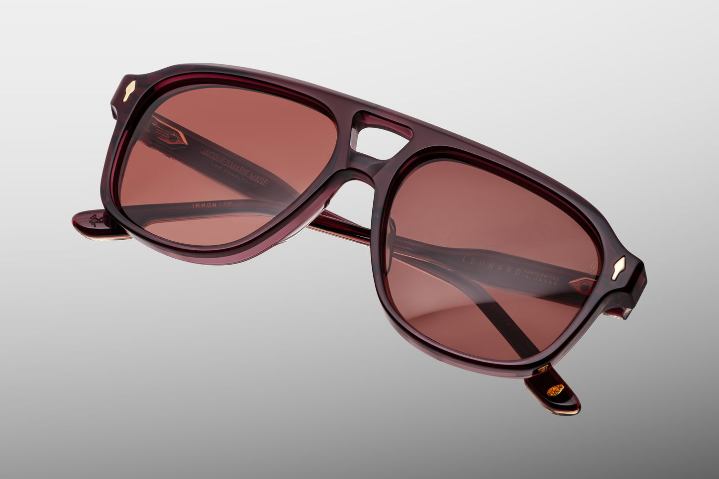 Jacques Marie Mage Leonard Amarena sunglasses rear view highlighting transparent cherry red acetate, sculpted temples and artisan Japanese craftsmanship