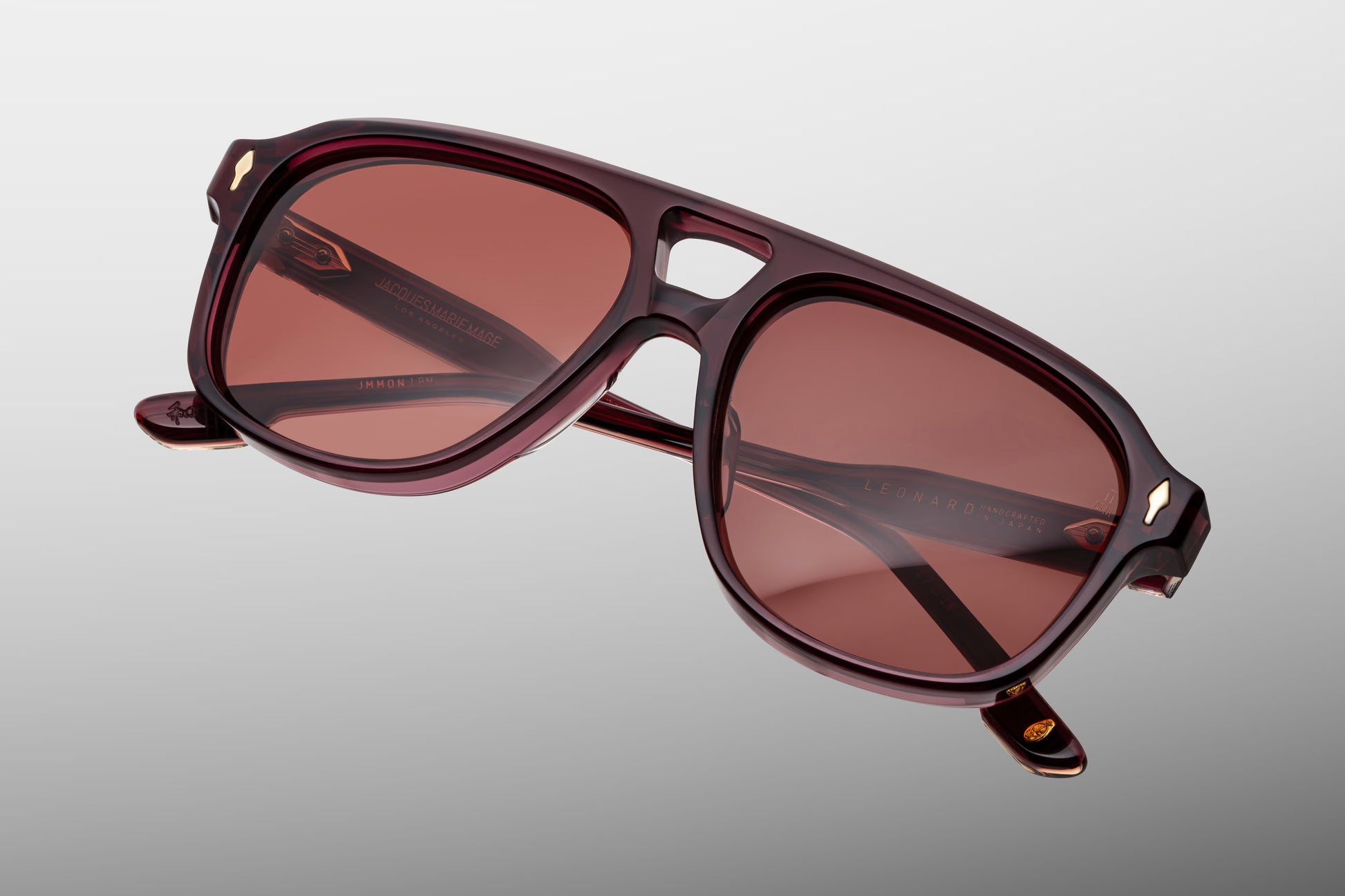 Jacques Marie Mage Leonard Amarena sunglasses rear view highlighting transparent cherry red acetate, sculpted temples and artisan Japanese craftsmanship