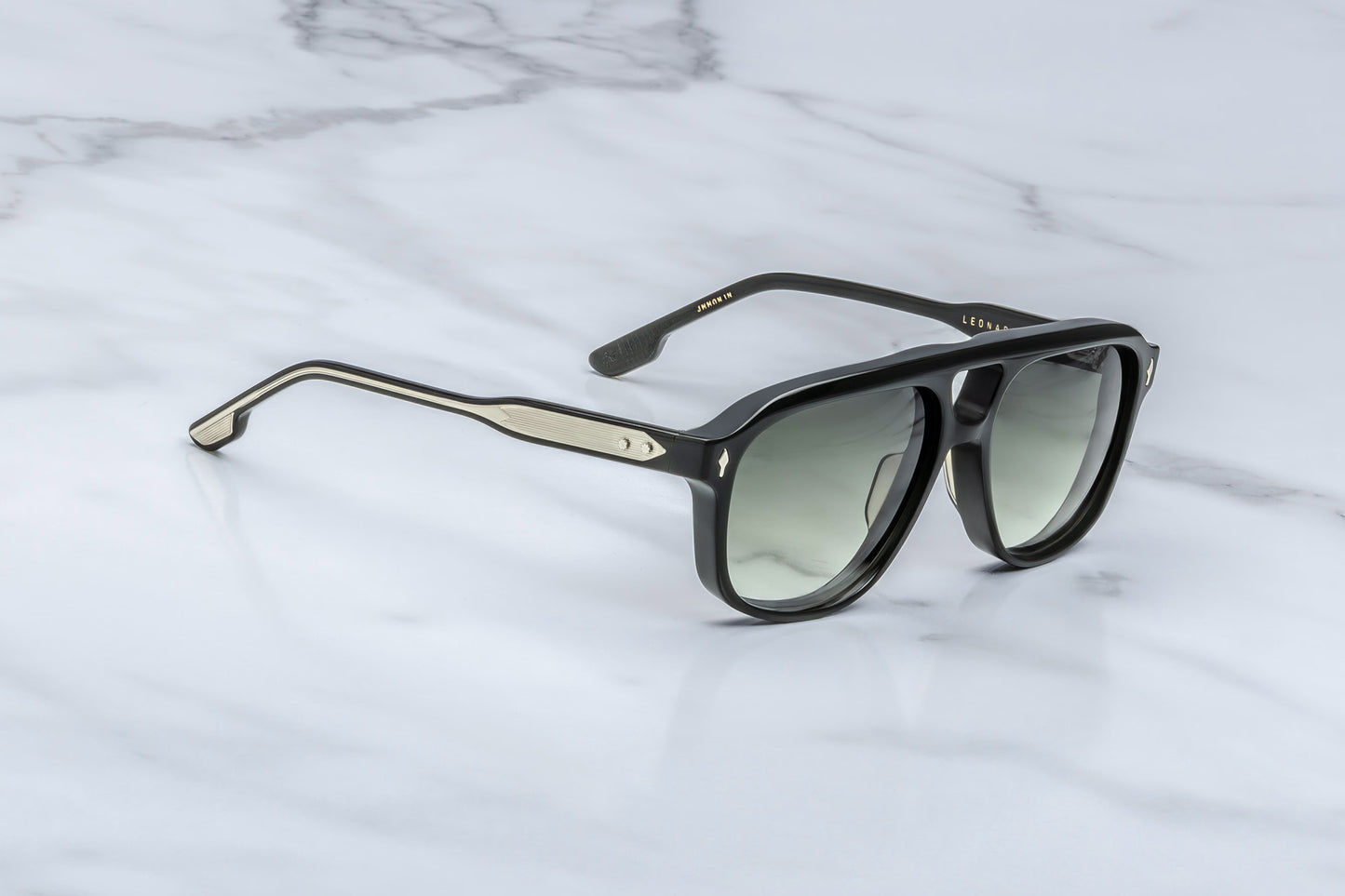acques Marie Mage Leonard Viper sunglasses side profile showcasing handcrafted black acetate temples, exposed wirecore detailing and green gradient lenses

Temple Close-Up