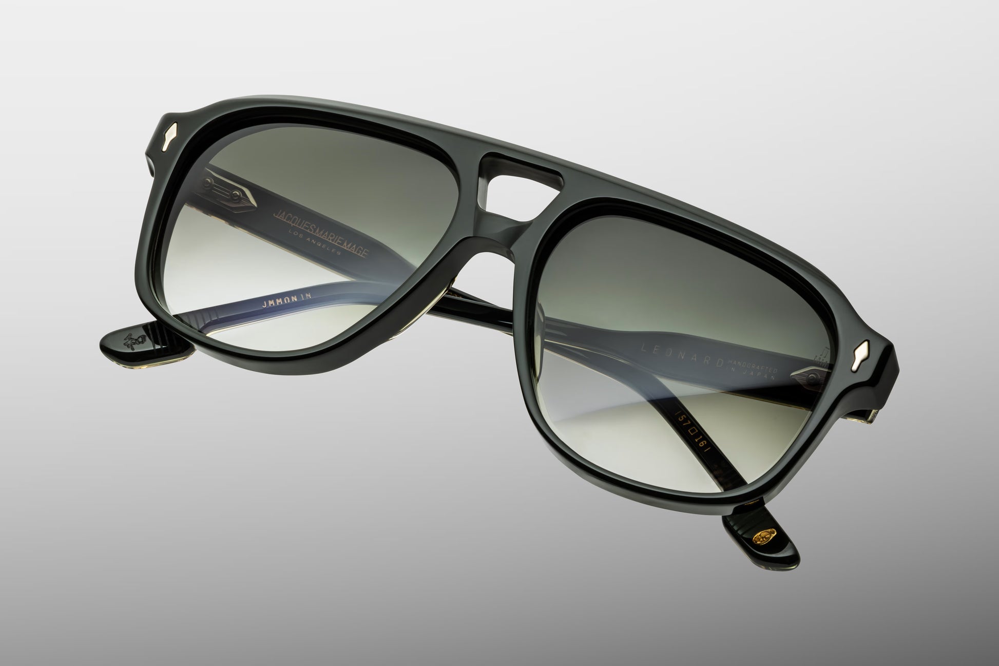 Close-up front view of Jacques Marie Mage Leonard Viper sunglasses featuring a refined 1980s-inspired navigator shape, double bridge and emerald gradient lenses