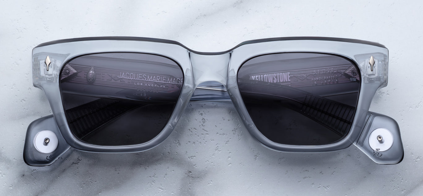 Front view of Jacques Marie Mage Lupine Storm rectangular spectacles in clear blue acetate, featuring gradient Wonder gray lenses and silver arrowhead front pins.
