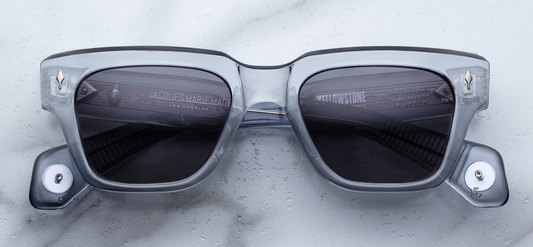 Front view of Jacques Marie Mage Lupine Storm rectangular spectacles in clear blue acetate, featuring gradient Wonder gray lenses and silver arrowhead front pins.
