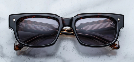 Front view of eyeglasses by Jacques Marie Mage Mattei in Beau with Havana 10mm cured cellulose acetate frame with custom double laminated acetate temples featuring precious metal hardware and blue lenses. Available at WINK Optometrists.