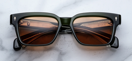 Jacques Marie Mage Molino Borneo sunglasses front view, rectangular green acetate frame with subtle beveling and tinted lenses
Front view of JMM Molino Borneo eyeglasses, 60s-inspired thick acetate frame in deep green with silver arrowhead pins