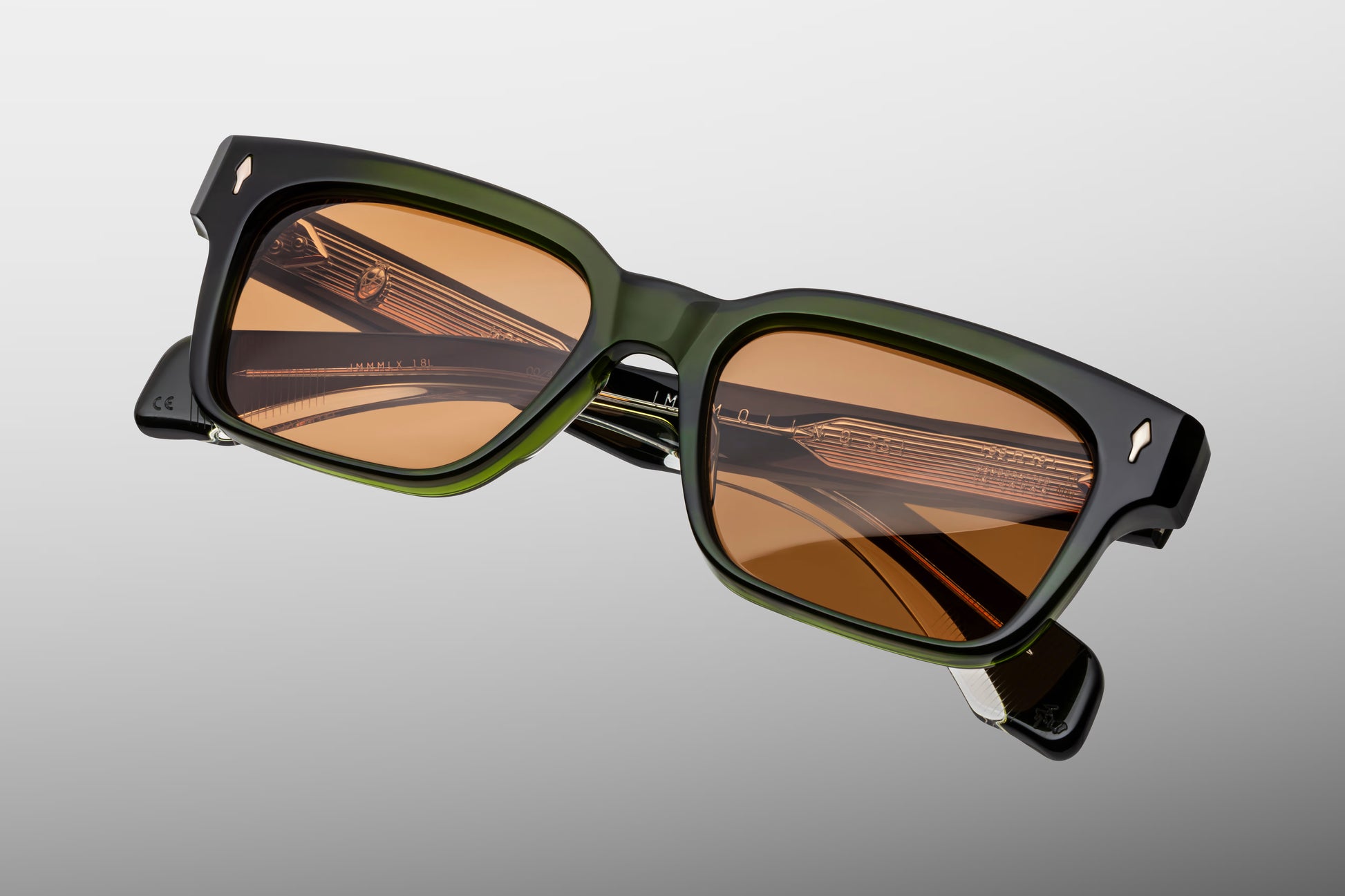 Close-up side detail of Jacques Marie Mage Molino Borneo showing engraved silver wire core, hinge construction and layered acetate temples
Macro side view of JMM Molino Borneo sunglasses highlighting premium hardware and temple detailing