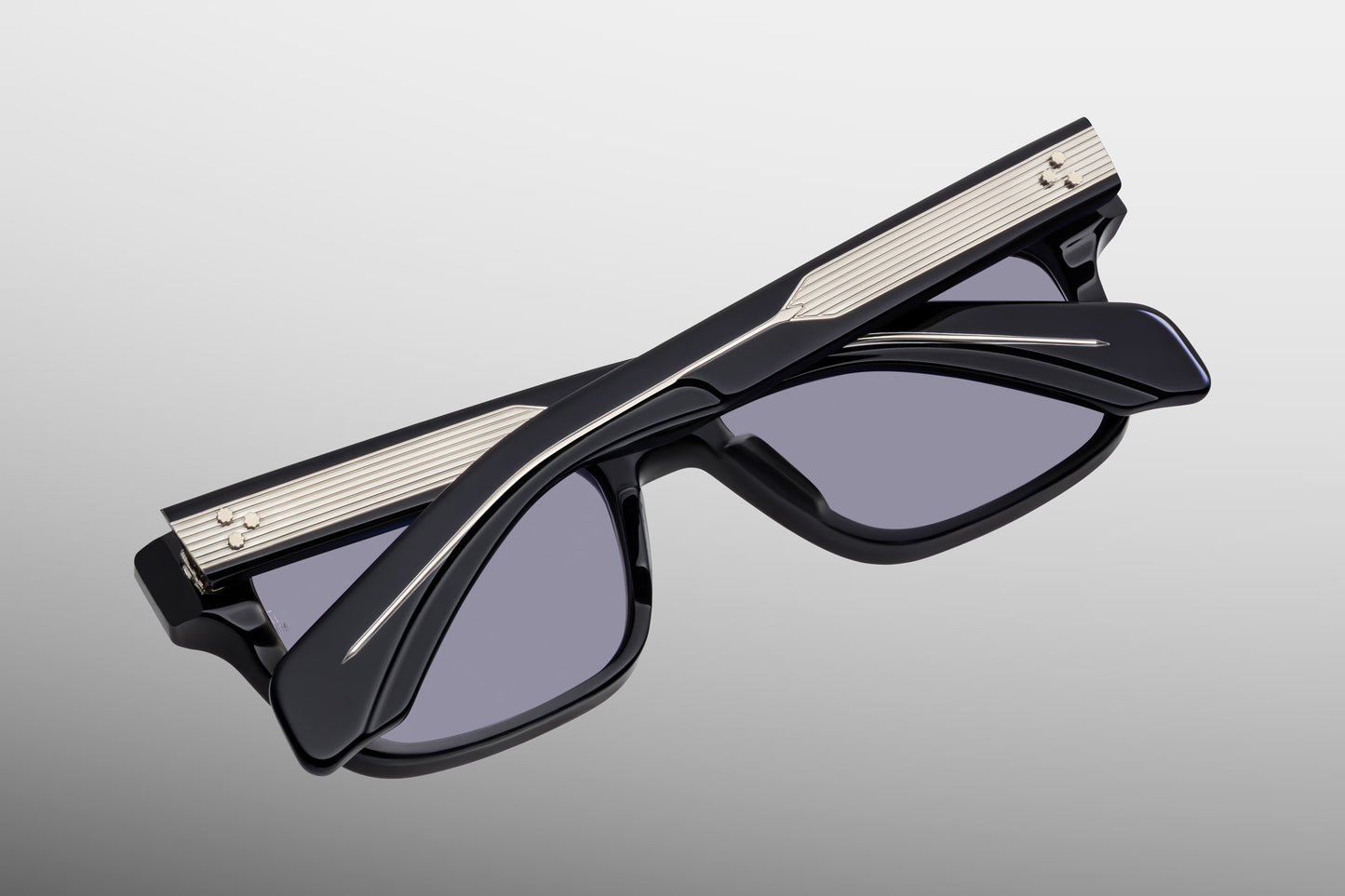 Close-up side detail of Jacques Marie Mage Molino Hudson showing engraved wire core, hinge construction and layered acetate temples
Macro side view of JMM Molino Hudson sunglasses highlighting premium hardware and temple detailing