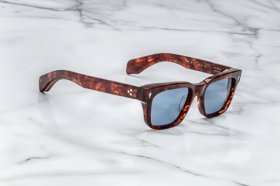 Three-quarter studio shot of the JMM Molino 51 Breccia, highlighting the thick 10mm block acetate structure, subtle bevel details, and the rich brown and amber tortoise shell pattern