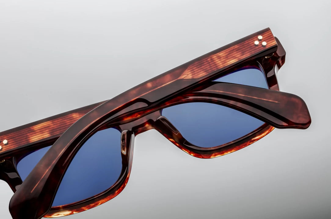 Rear view of the Jacques Marie Mage Molino 51 Breccia temples, highlighting the translucent amber and brown tones of the polished Havana tortoise shell acetate tips and the subtle gleam of the internal light gold