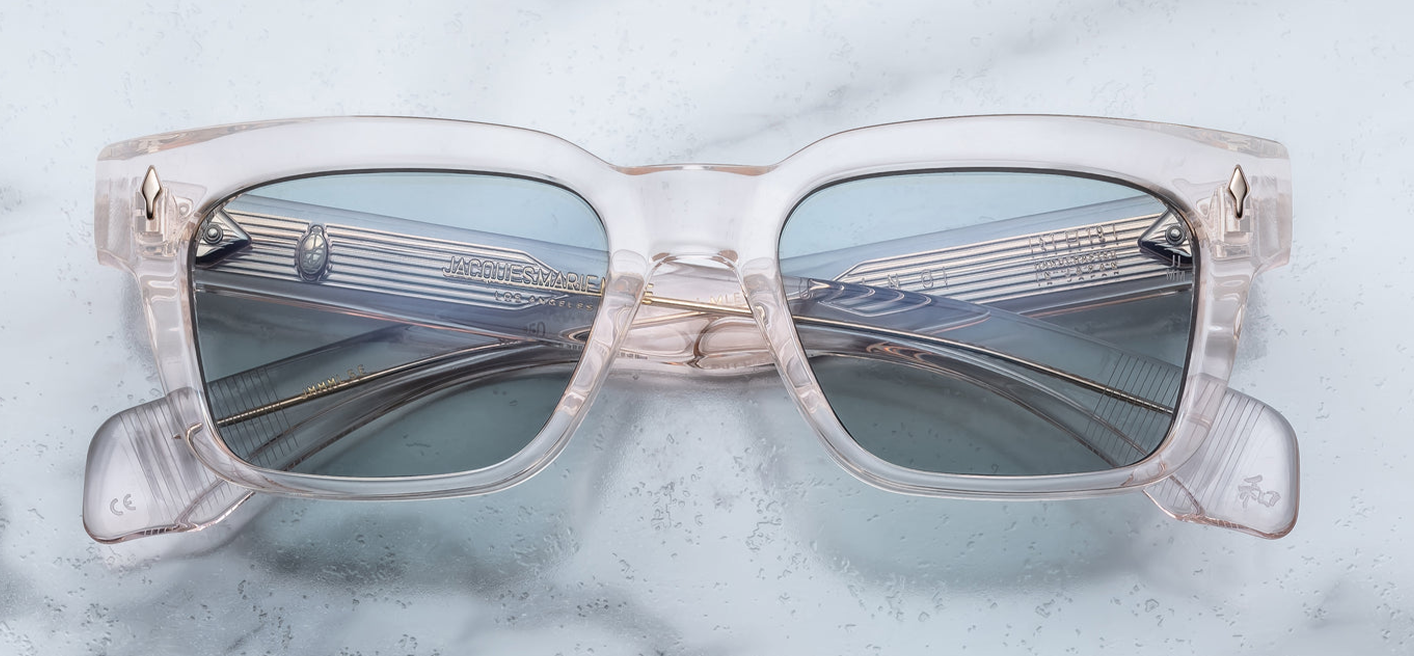 Front of the Molino Cameo — translucent pale pink‑cream (cameo) 10 mm cured cellulose acetate frame in a ’60s‑inspired rectangular shape, with angular lenses and gold arrowhead front pins
