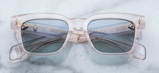 Front of the Molino Cameo — translucent pale pink‑cream (cameo) 10 mm cured cellulose acetate frame in a ’60s‑inspired rectangular shape, with angular lenses and gold arrowhead front pins