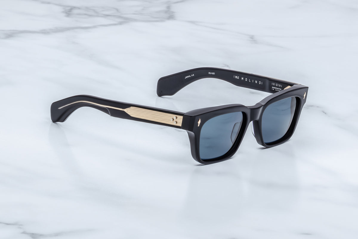 Three-quarter view of the Jacques Marie Mage Molino Lacquer sunglasses. The angle highlights the frame's structural volume, subtle edge beveling along the top brow, and the seamless transition into thick, high-gloss sculptural temples.