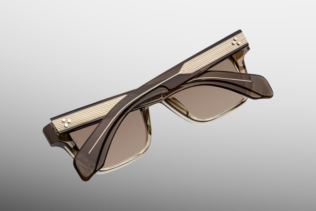 Inner rear view of Jacques Marie Mage Molino Lescot sunglasses, detailing the heavy-duty 5-barrel hinge with spur-shaped rivets and the limited-production batch number foil-stamped in silver on the dark brown inner temple.