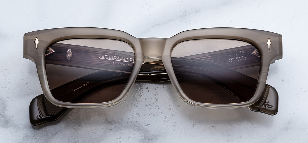 Front view of Jacques Marie Mage Molino Lescot sunglasses. Displays a bold, 1960s-inspired rectangular 10mm block acetate frame in a warm, polished tan-brown, fitted with solid brass-tinted golden lenses and sterling silver arrowhead pins.