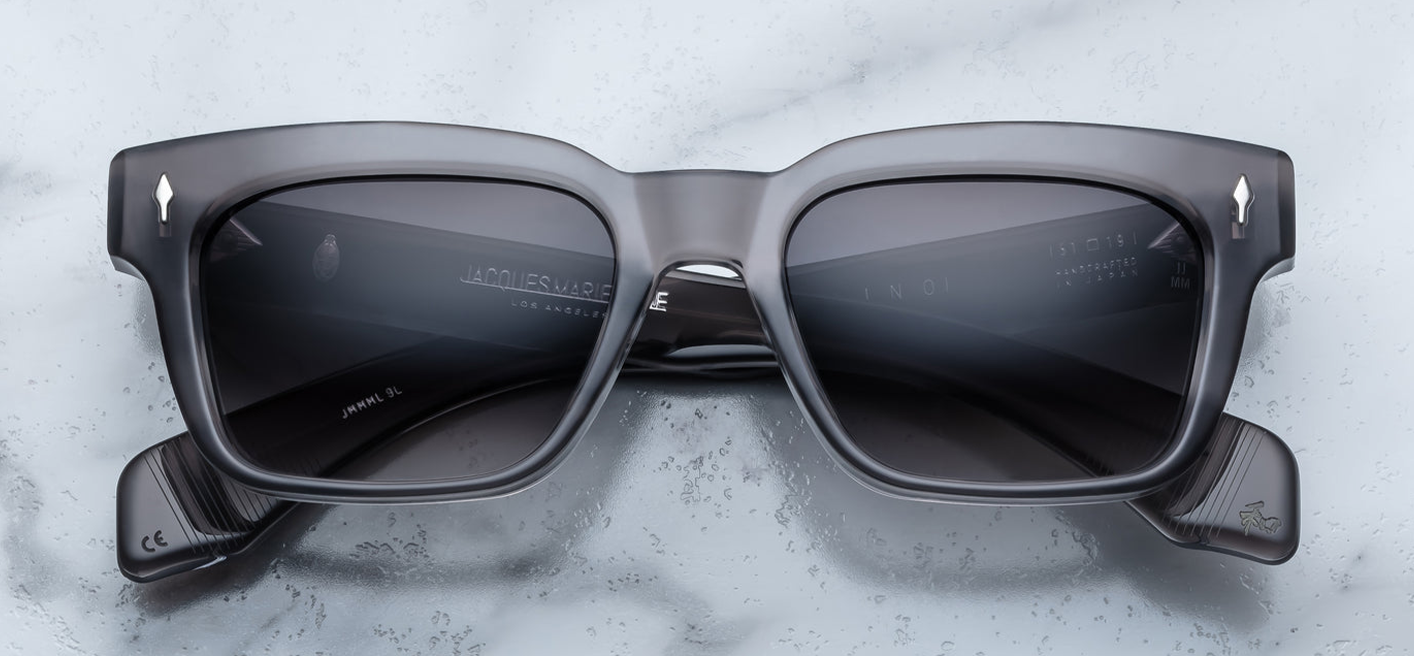 Front of the Molino 51 Prime — a blocky, rectangular 1960s-inspired frame in grey 10 mm cured cellulose acetate, with a subtle bevel and sterling silver arrowhead front pin