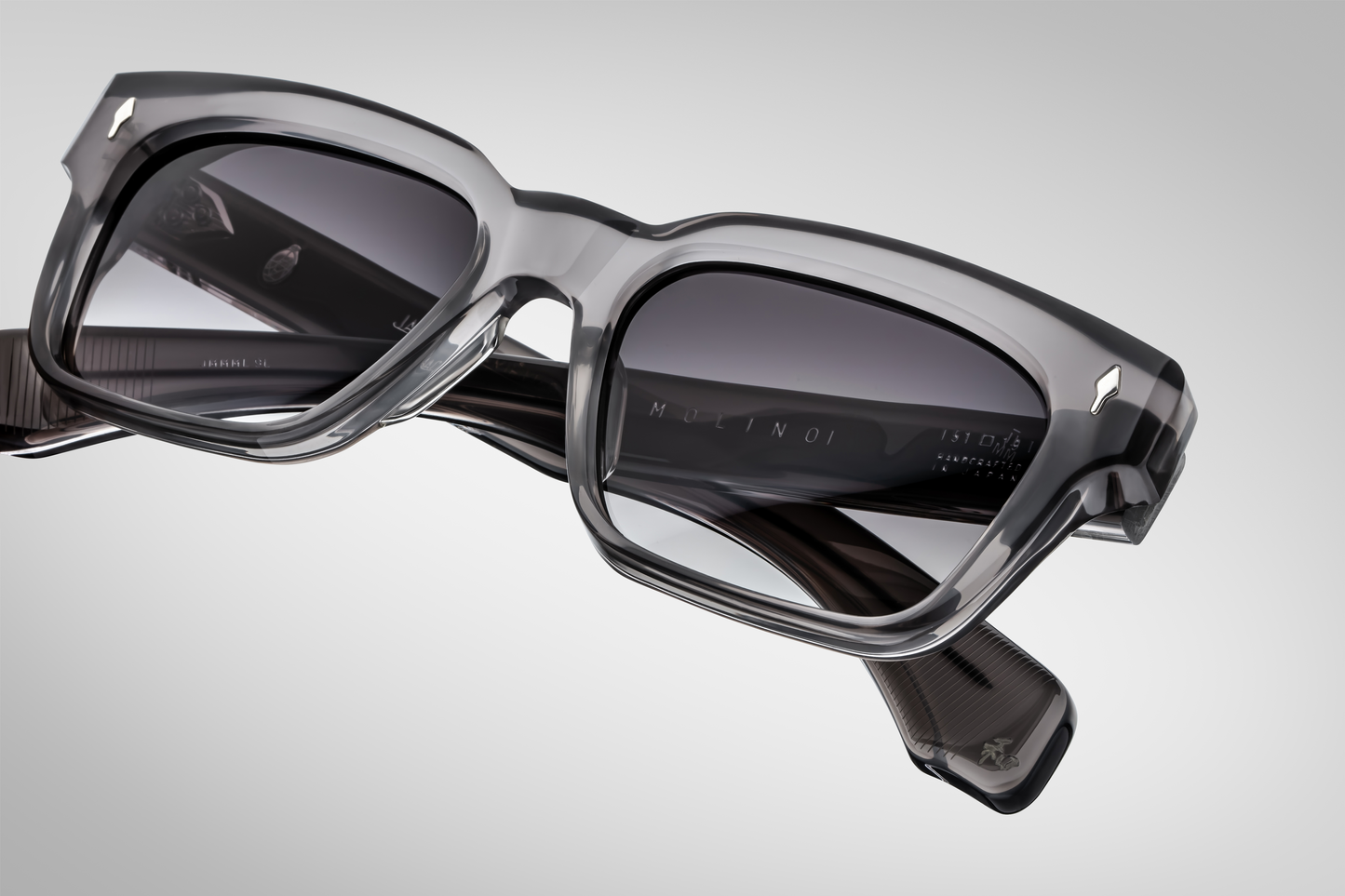 Overhead of the Molino 51 Prime — the gently arched bridge, the frame’s thick acetate block, and how the temples curve outward from the brow.