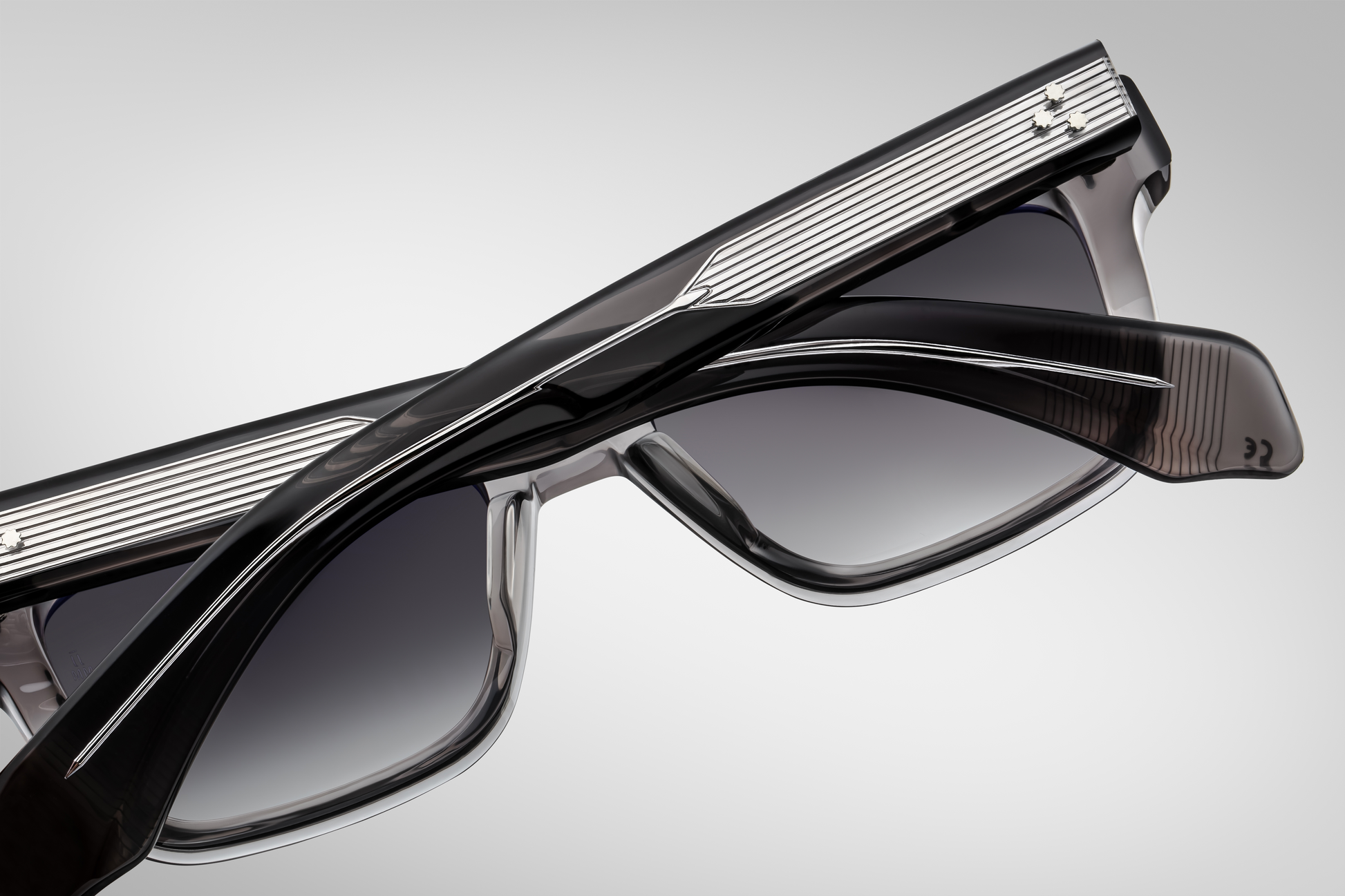 Interior of the Molino 51 Prime — smooth inner surface of the grey acetate frame, visible silver wire-core inside the temples, and the engraved serial number on the arm