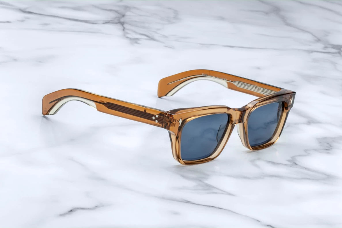 Three-quarter studio shot of the JMM Molino 51 Whiskey, highlighting the thick 10mm block acetate structure, sculpted bevel details, and the warm, honey-toned transparency of the frame