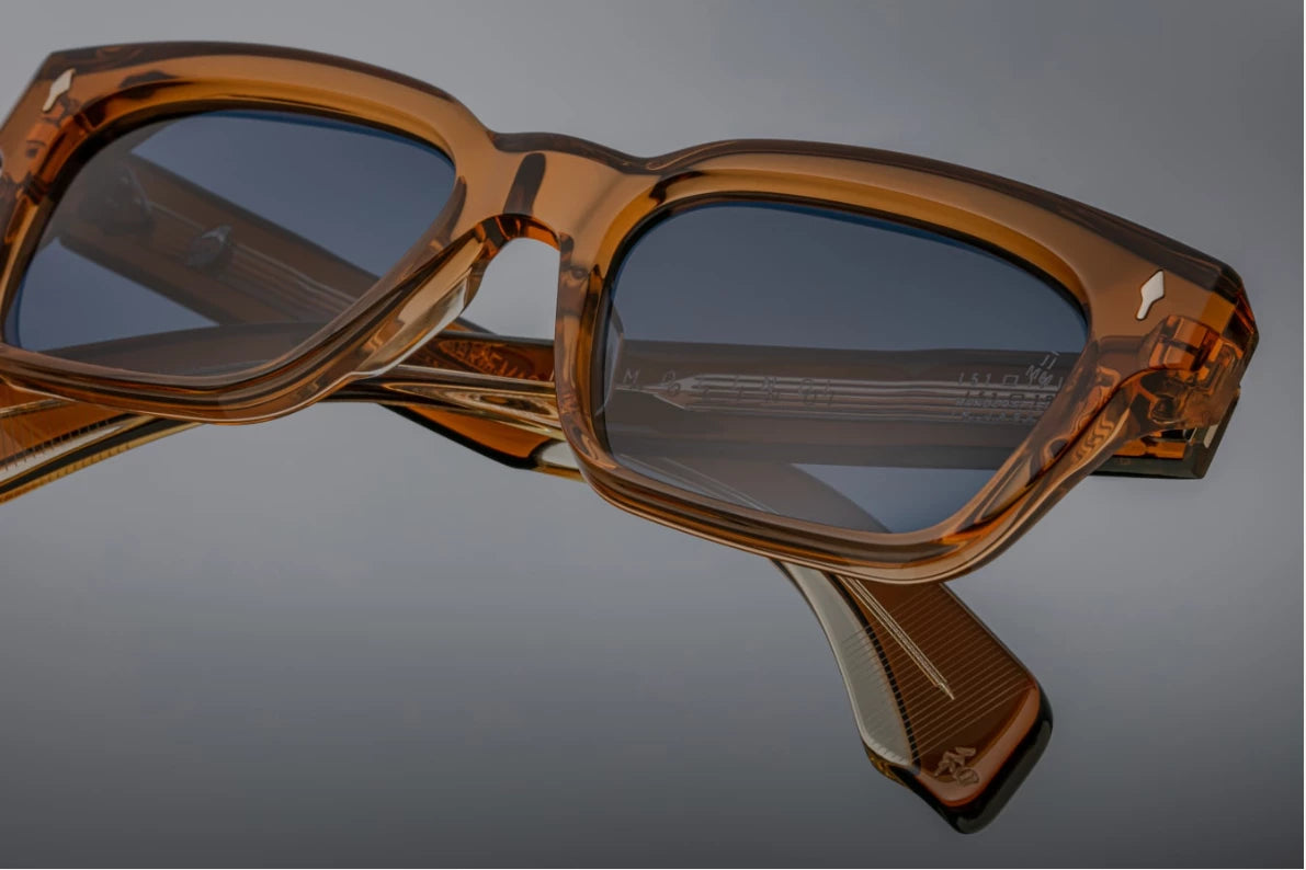 Top-down view of the JMM Molino 51 Whiskey sunglasses, revealing the frame's structural thickness, the heavy 10mm acetate brow line, and the silver tension-secured 7-barrel hinges