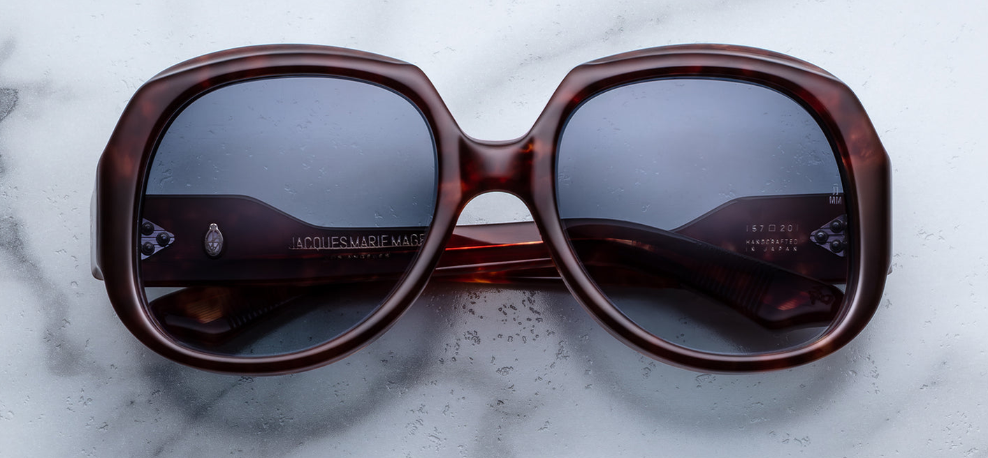 JMM Ocean Child Breccia — oversized late‑’70s rounded-square frame in warm reddish-brown breccia acetate with gradient denim lenses