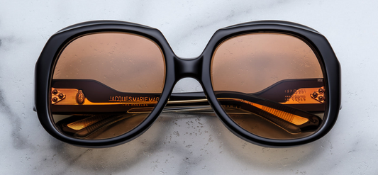 Jacques Marie Mage Ocean Child Beluga — oversized late‑’70s rounded‑square frame in deep midnight (beluga) acetate with warm gradient bronze lenses