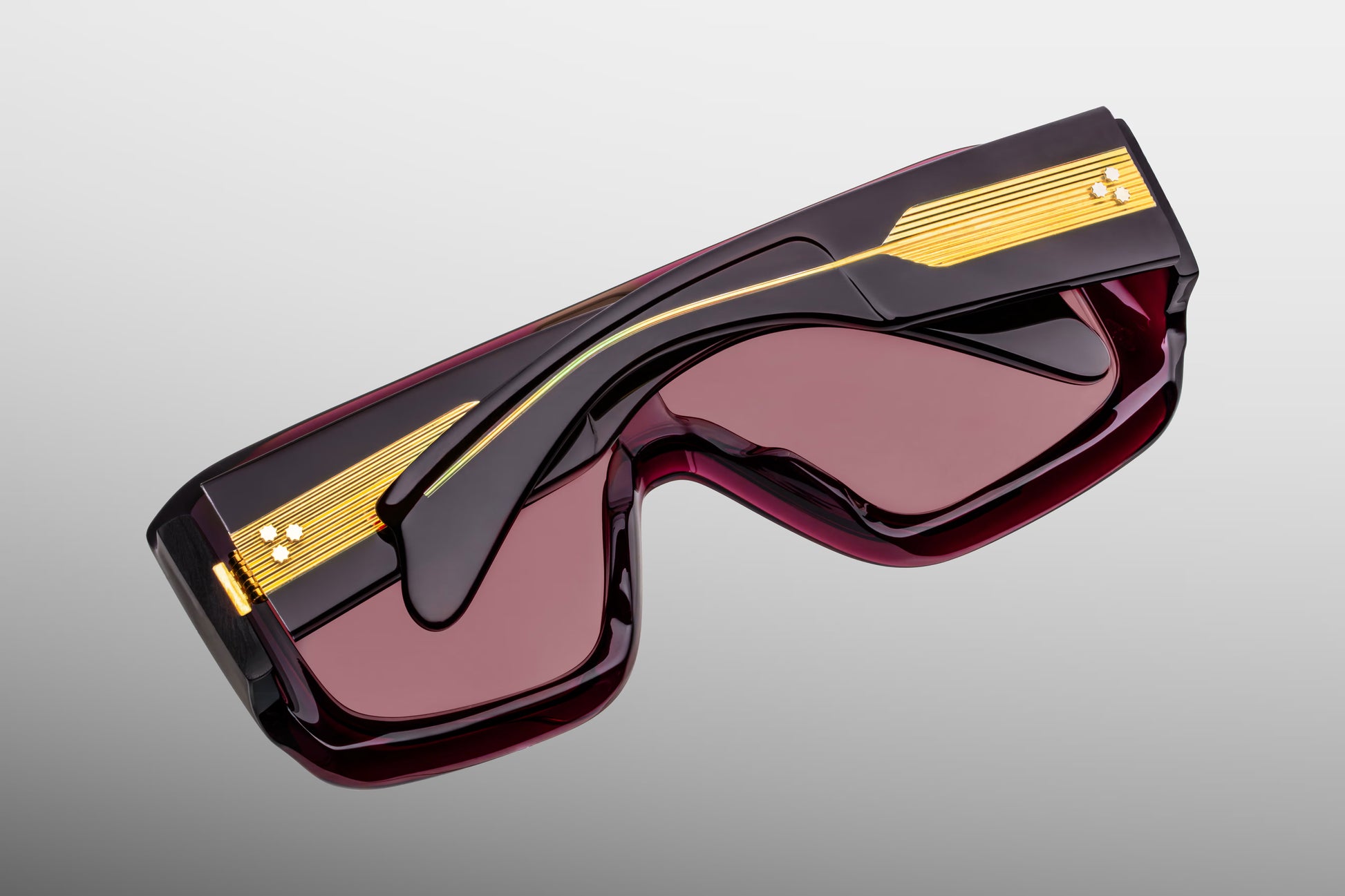 Close-up back view of Jacques Marie Mage Pausa Amarena sunglasses showing inner temple engraving and exposed gold wire core
Rear detail of JMM Pausa Amarena frame revealing handcrafted acetate interior and limited edition markings