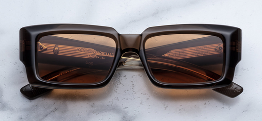 Jacques Marie Mage Quant sunglasses in London front view – bold grey acetate square frame with dark lenses and signature arrowhead rivets – available at Wink Optometrists