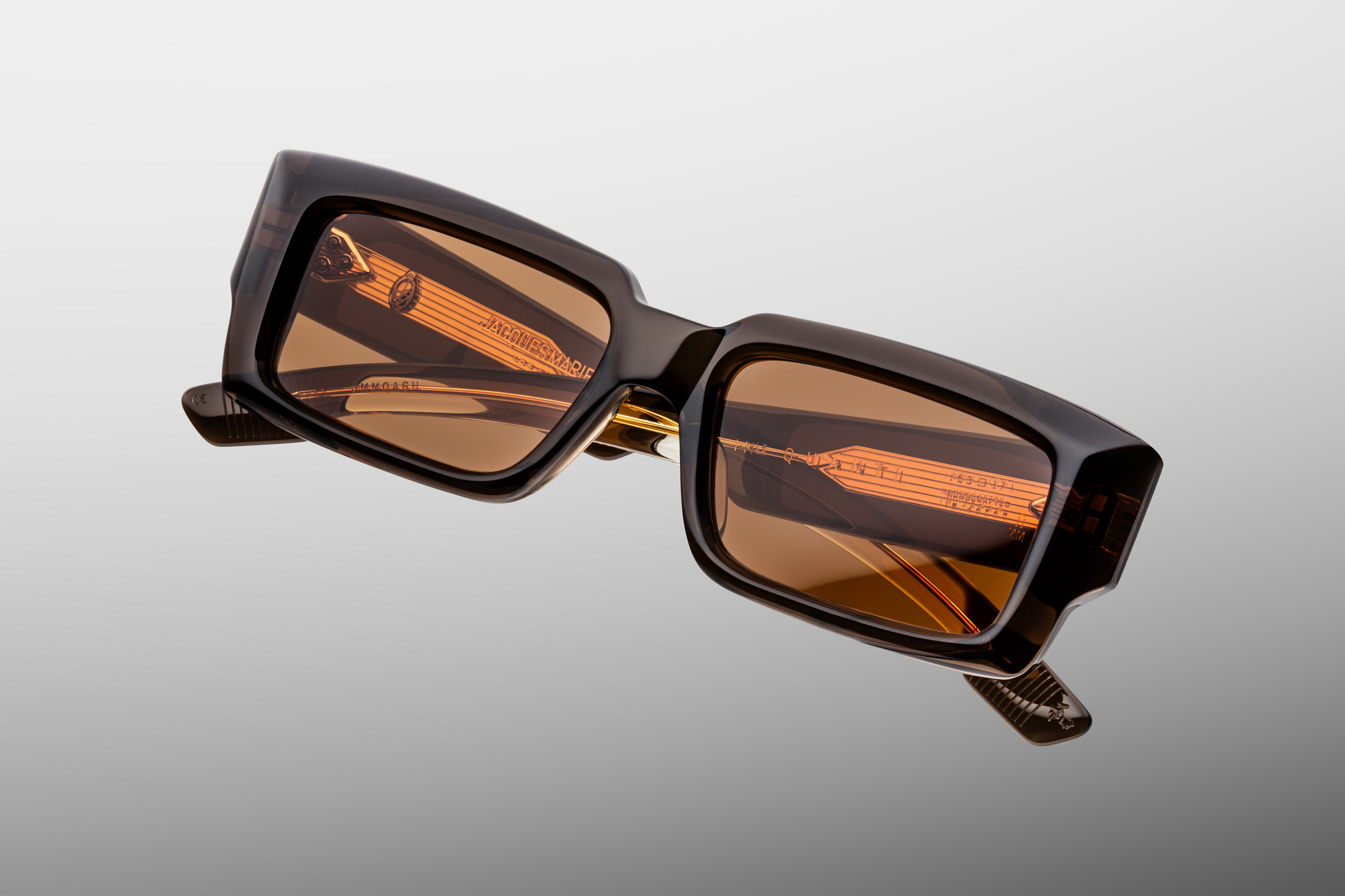 Close up front detail of Jacques Marie Mage Quant sunglasses in London showing signature arrowhead rivets, sculpted acetate frame and dark lenses – available at Wink Optometrists