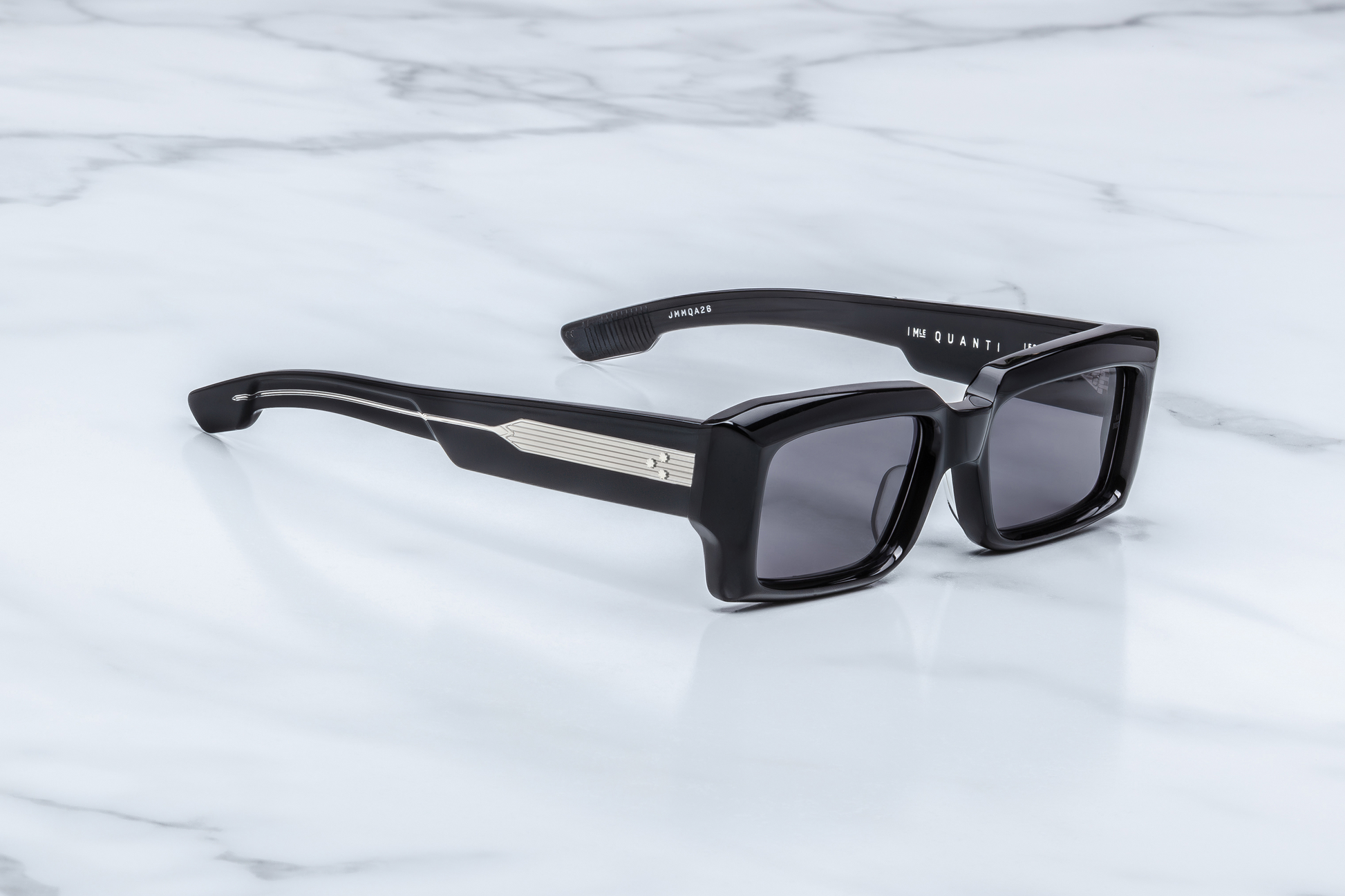 Jacques Marie Mage Quant Shadow sunglasses three quarter angle highlighting sculpted black acetate frame, thick temples and luxury craftsmanship – available at Wink Optometrists
