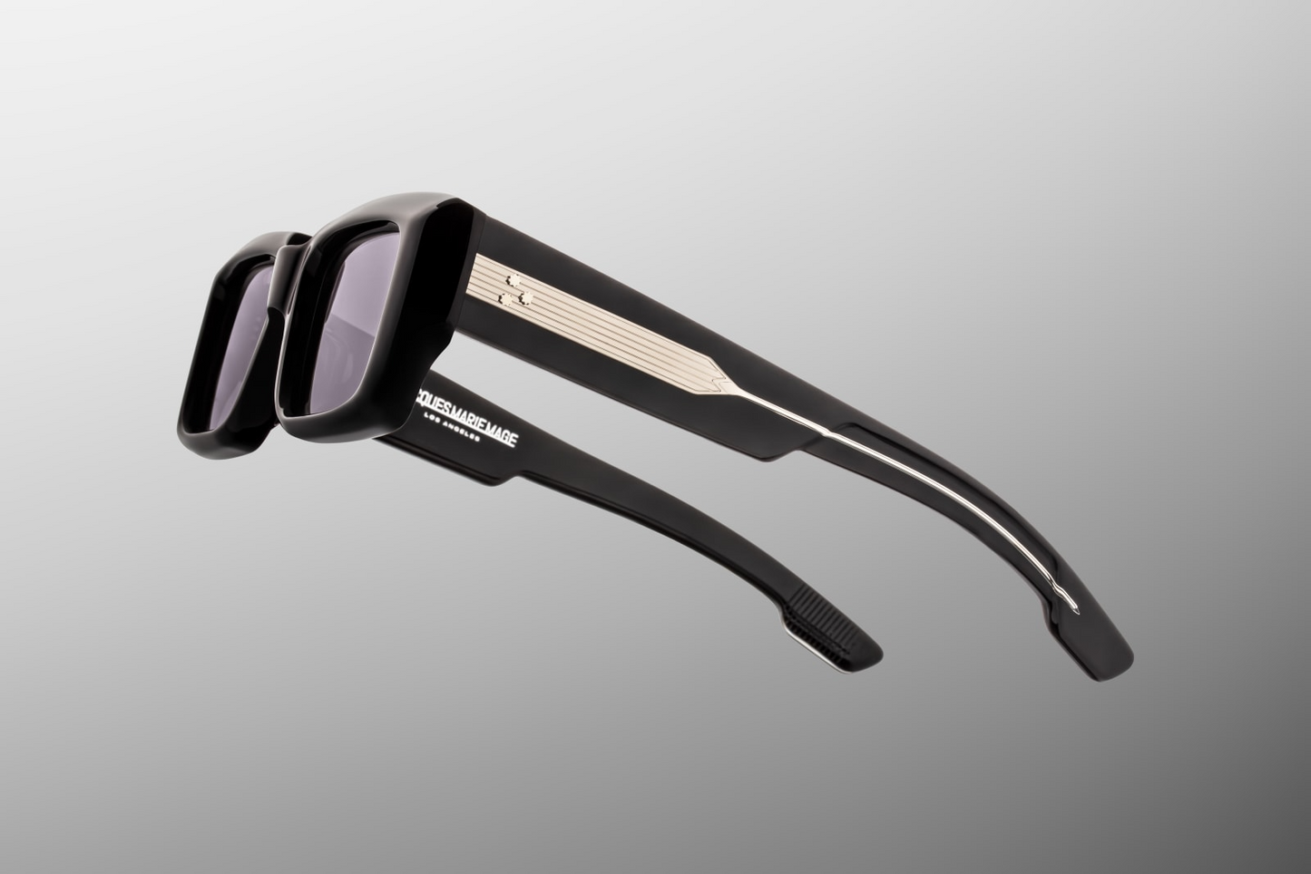 Close up temple detail of Jacques Marie Mage Quant Shadow sunglasses showing engraved wire core and premium acetate temple design – available at Wink Optometrists