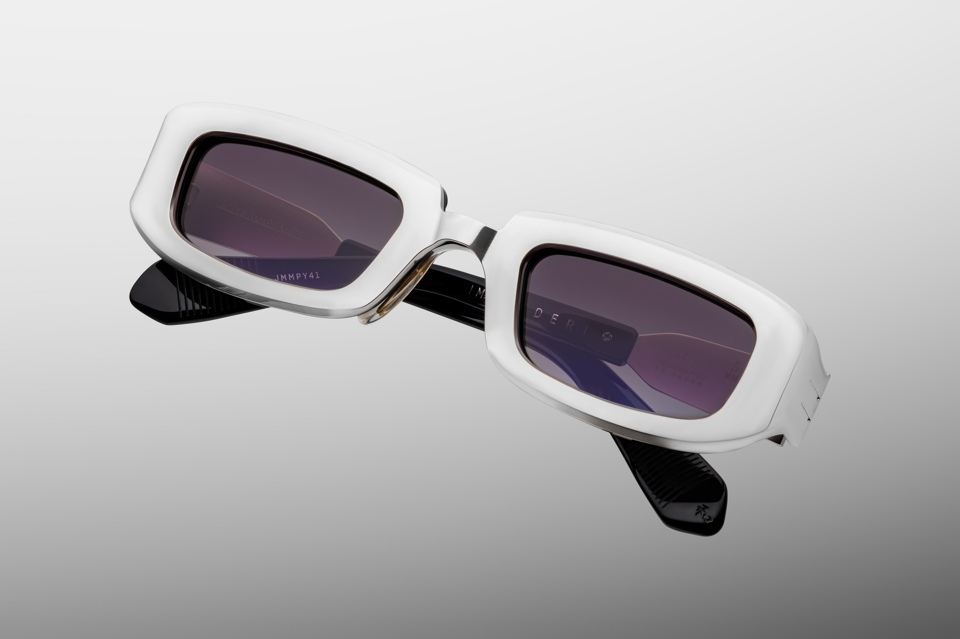 Close up front detail of Jacques Marie Mage Ryder sunglasses in Silver showing refined titanium construction, sculpted bridge and premium tinted lenses – available at Wink Optometrists