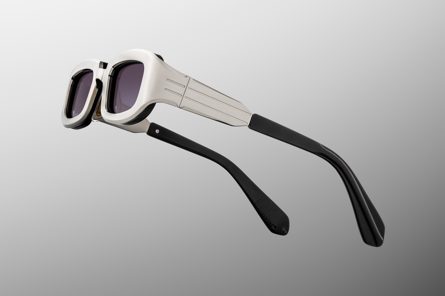 Close up temple detail of Jacques Marie Mage Ryder Silver sunglasses showing engraved metal temples and luxury titanium eyewear design – available at Wink Optometrists