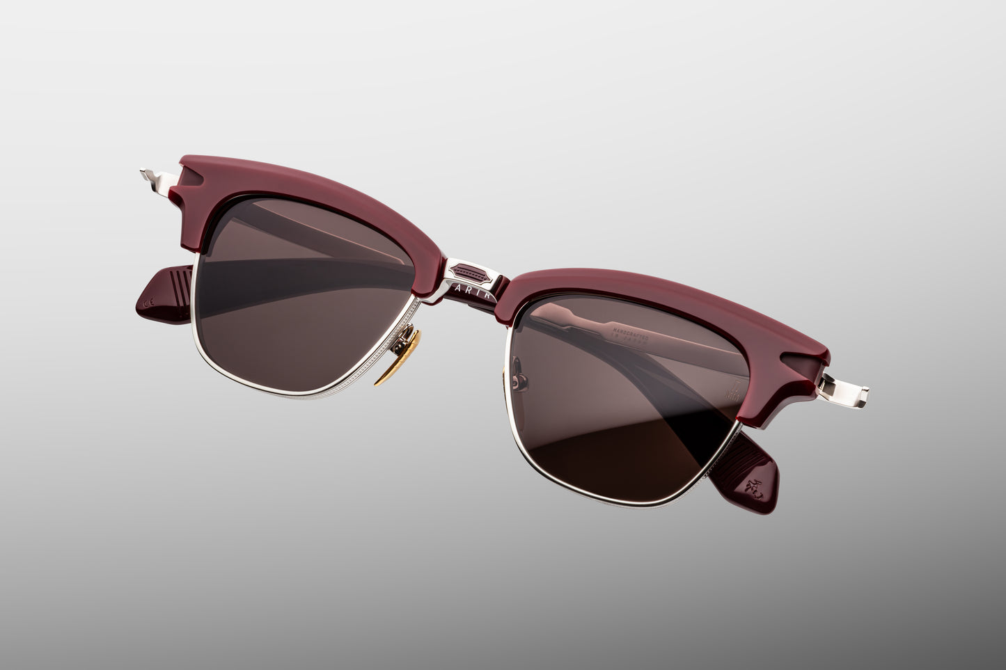 Jacques Marie Mage Sartre Bordeaux sunglasses top view highlighting rich burgundy acetate browline and sculptural titanium frame construction