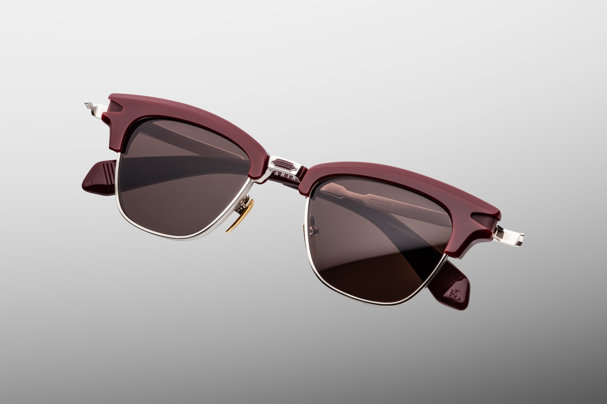 Jacques Marie Mage Sartre Bordeaux sunglasses top view highlighting rich burgundy acetate browline and sculptural titanium frame construction
