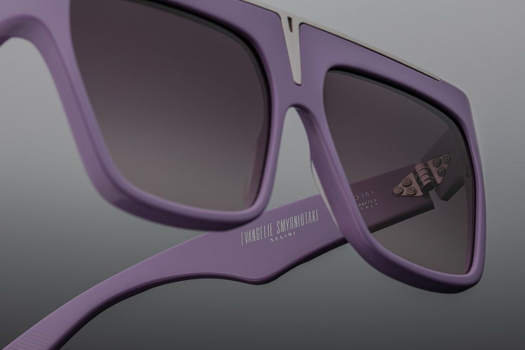 “Macro view of Selini purple — cured cellulose acetate showing the subtle sheen, silver wire-core, and delicate hinge