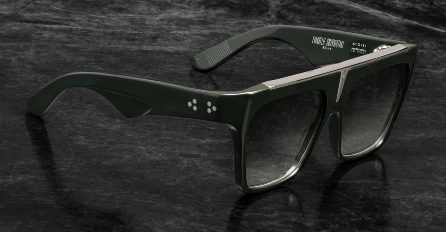 Side profile of Selini Viper — layered acetate temples and silver hardware, showing the hidden silver wire-core inside the green frame