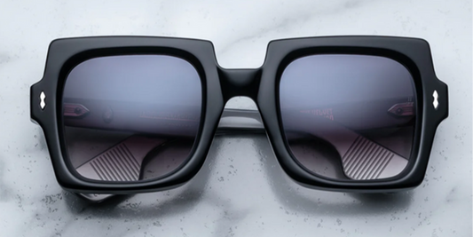 Front view of Jacques Marie Mage Velvet Underground Squeeze sunglasses in Noir, featuring bold rectangular black acetate frames and dark lenses