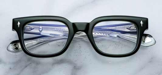 Jacques Marie Mage Stewart Borneo optical frame front view, rectangular mid-century eyeglasses in green acetate with sculpted silhouette
Front view of JMM Stewart Borneo glasses, boxy rectangular frame in deep green acetate with signature arrowhead rivets