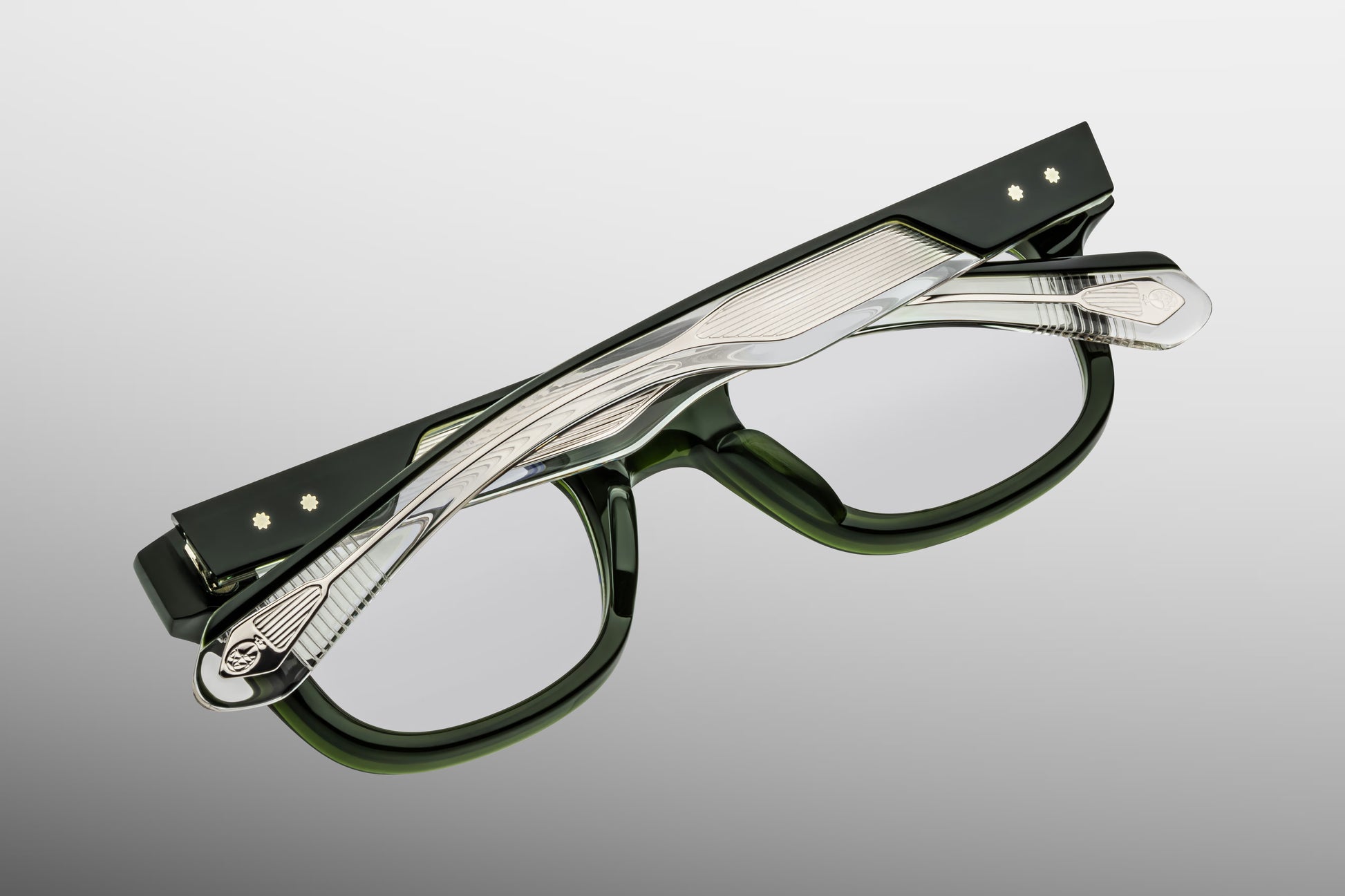 Close-up side detail of Jacques Marie Mage Stewart Borneo showing engraved wirecore, 5-barrel hinge construction and layered acetate temples
Macro side view of JMM Stewart Borneo eyeglasses highlighting premium hardware and temple structure