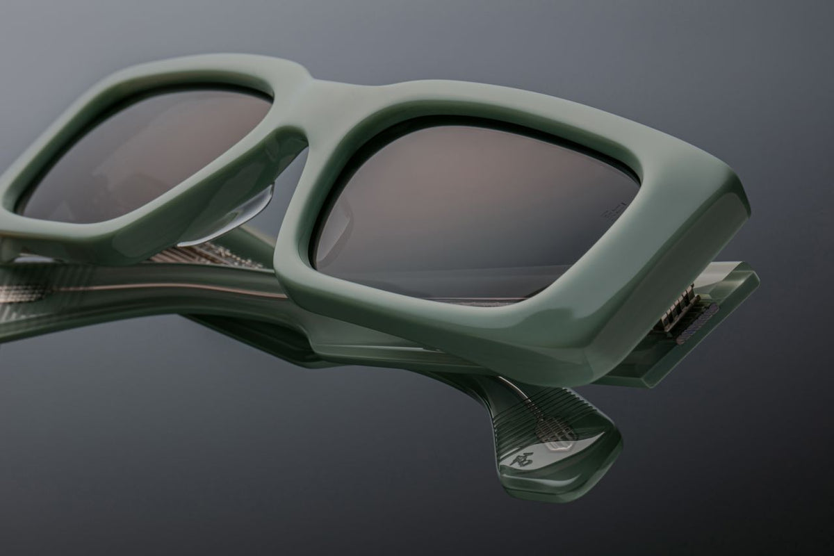Close up of sterling silver arrowhead pins on JMM Supersonic Glacier frames available at WINK Optometrists.