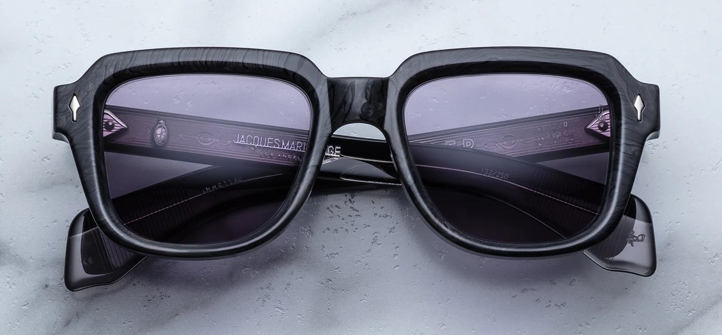 JMM Taos Ebony — rectangular ‘60s-inspired frame in charcoal‑burlwood (deep grey/black) acetate with sterling silver arrowhead front pins and Nimbus‑grey lenses