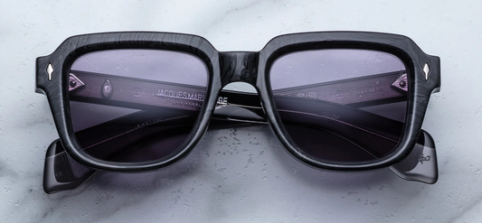 JMM Taos Ebony — rectangular ‘60s-inspired frame in charcoal‑burlwood (deep grey/black) acetate with sterling silver arrowhead front pins and Nimbus‑grey lenses