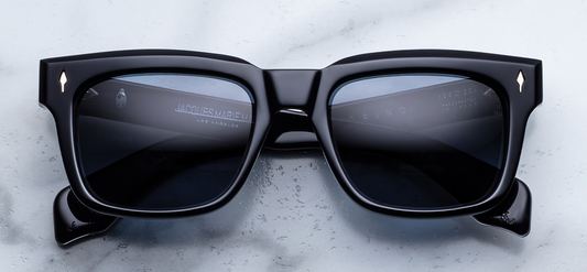  Front view of Jacques Marie Mage Torino Lacquer sunglasses. Features a bold, 1960s-inspired rectangular 10mm block acetate frame in a deep, glossy ink blue that borders on black, fitted with solid smoky dark lenses and light-gold arrowhead front pins.