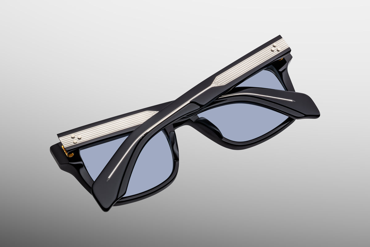 Inner rear view of Jacques Marie Mage Torino Obscure sunglasses, detailing the heavy-duty 7-barrel hinge with spur-shaped rivets and the limited-production batch number foil-stamped in gold on the interior temple arm.
