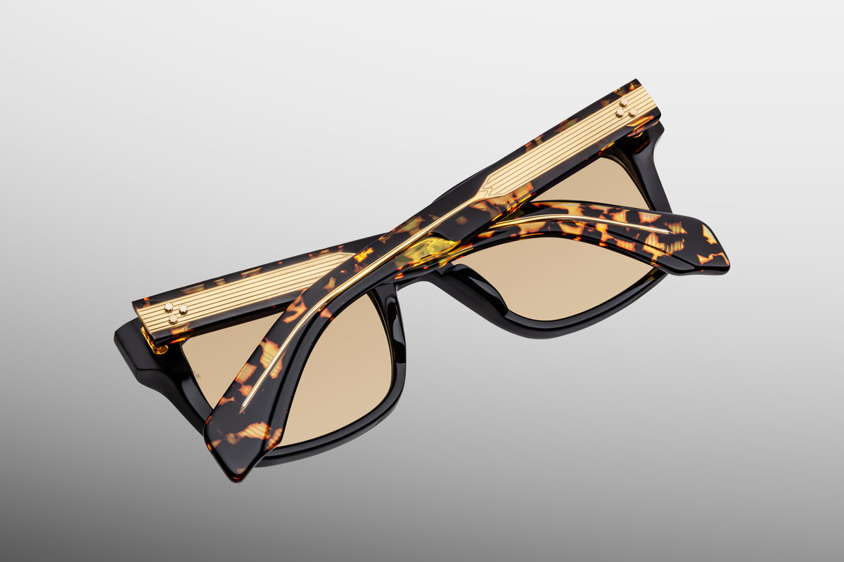 Inner rear view of Jacques Marie Mage Torino Tavern sunglasses, detailing the heavy-duty 7-barrel hinge with spur-shaped rivets and the limited-production batch number foil-stamped in gold on the interior temple arm.