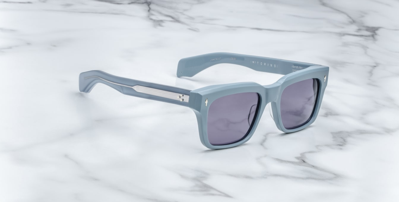 Profile of Jacques Marie Mage Molino Tiger — double-laminated blue acetate temples showing engraved silver core wire and custom 7-barrel hinge with rivets