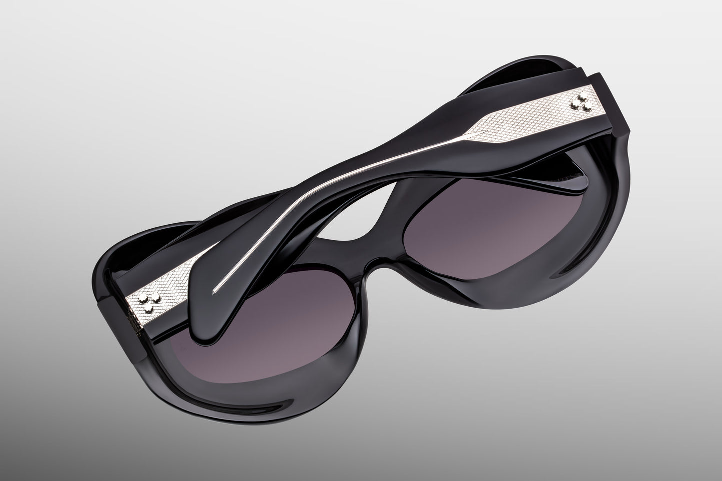 Close-up back view of Jacques Marie Mage Twins Shadow sunglasses showing inner temple engraving and exposed wirecore structure
Rear detail of JMM Kubrick Twins Shadow frame revealing handcrafted acetate interior and limited edition markings