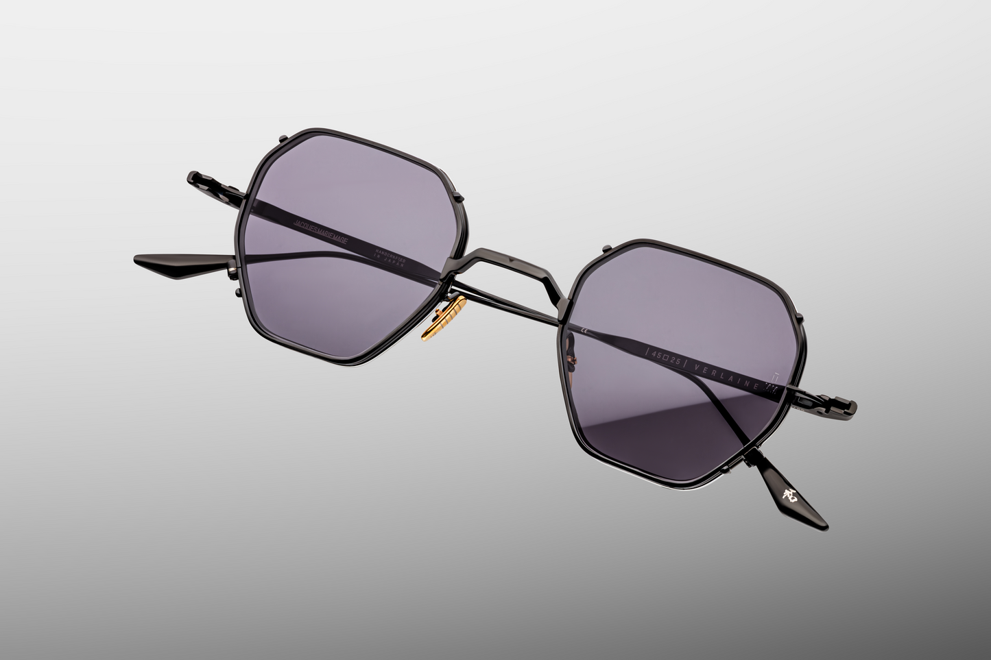 Close up front detail of Jacques Marie Mage Verlaine sunglasses in Corbeau showing signature arrowhead rivets, sculpted acetate frame and dark lenses – available at Wink Optometrists