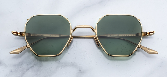 Jacques Marie Mage Verlaine sunglasses in Muskett front view – bold square translucent brown acetate frame with dark lenses and signature arrowhead rivets – available at Wink Optometrists