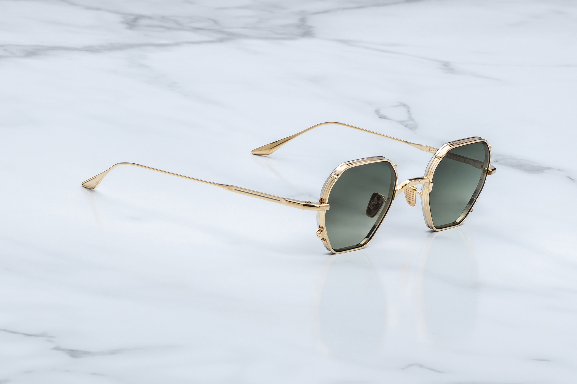 Jacques Marie Mage Verlaine Muskett sunglasses three quarter angle highlighting sculpted translucent brown acetate frame, thick temples and luxury craftsmanship – available at Wink Optometrists
