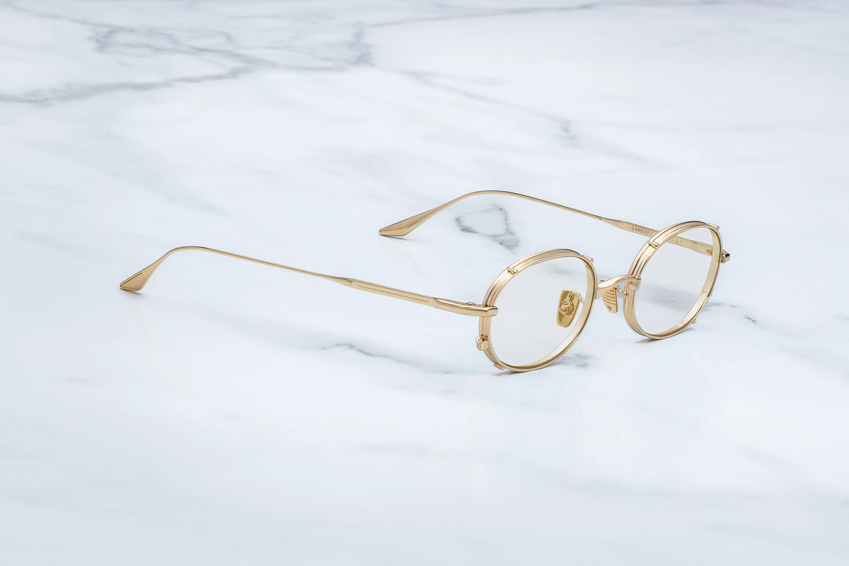 Side profile view of the Jacques Marie Mage Violet RX glasses. The minimalist, featherlight beta-titanium temple arms extend straight back, showcasing an incredibly sleek, thin profile that transitions into custom sculpted, structural winged temple tips